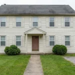 Don't Settle for Beige: See 12 Incredible Exterior Makeovers of This Colonial Home